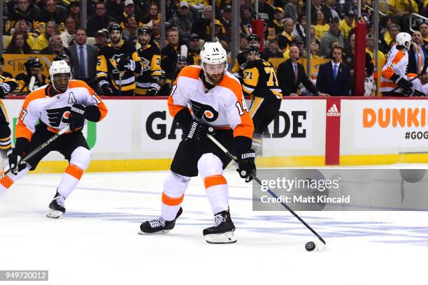 Sean Couturier of the Philadelphia Flyers skates with the puck against the Pittsburgh Penguins in Game Five of the Eastern Conference First Round...