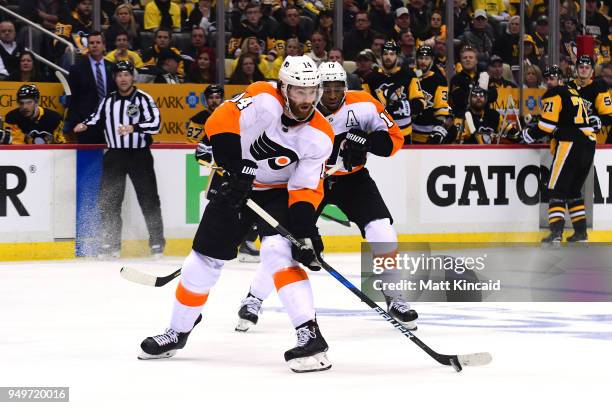 Sean Couturier of the Philadelphia Flyers skates with the puck against the Pittsburgh Penguins in Game Five of the Eastern Conference First Round...