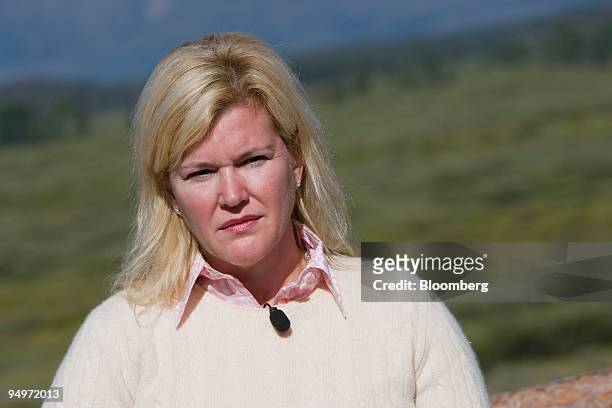 Meredith Whitney, chief executive officer of Meredith Whitney Advisory Group, listens during a television interview at the Jackson Lake Lodge during...