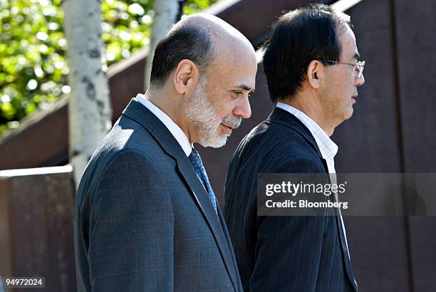 Ben S. Bernanke, chairman of the U.S. Federal Reserve, left, walks with Masaaki Shirakawa, governor of the Bank of Japan, outside the Jackson Lake...