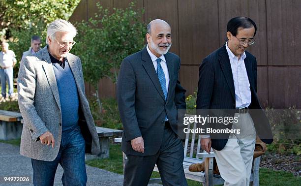 Ben S. Bernanke, chairman of the U.S. Federal Reserve, center, walks with Jean-Claude Trichet, president of the European Central Bank, left, and...