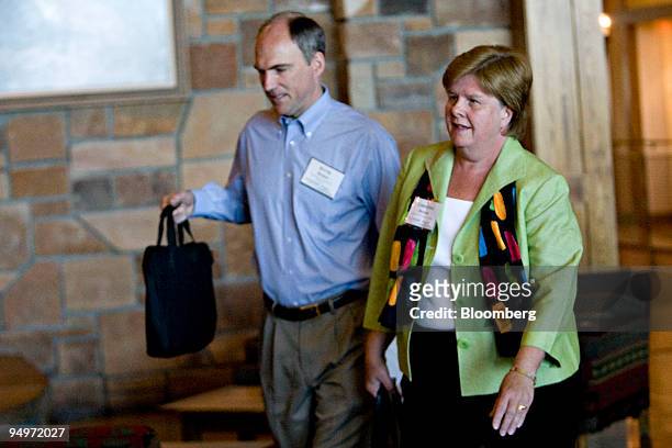 Christina Romer, chairman of the U.S. Council of Economic Advisers, right, walks with David Romer, economy professor at the University of California...
