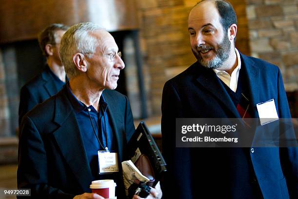 Arminio Fraga, former governor of the Central Bank of Brazil, right, walks with Stanley Fischer, governor of the Bank of Israel, as they arrive for a...