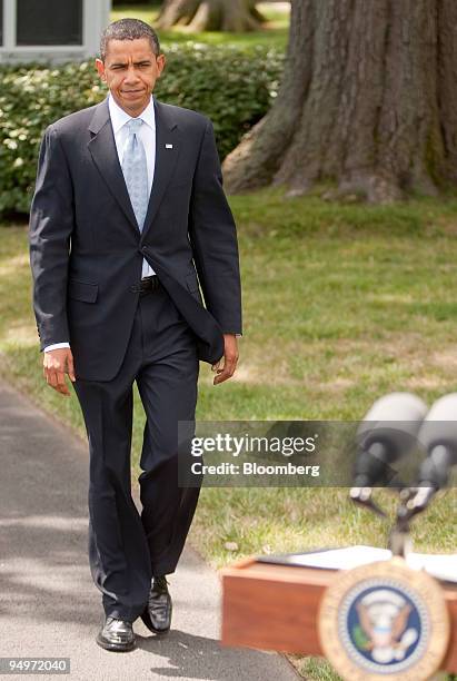 President Barack Obama walks out to speak to the media on South Lawn of the White House in Washington, D.C., U.S., on Friday, Aug. 21, 2009. Obama...