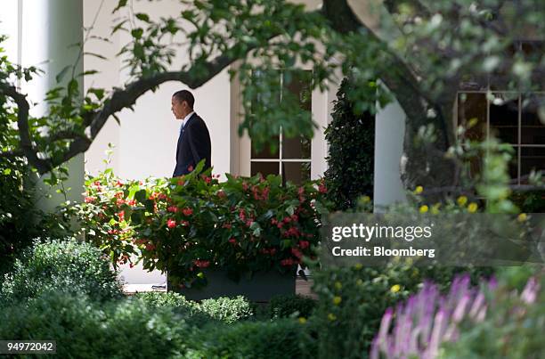 President Barack Obama walks out to speak to the media on South Lawn of the White House in Washington, D.C., U.S., on Friday, Aug. 21, 2009. Obama...