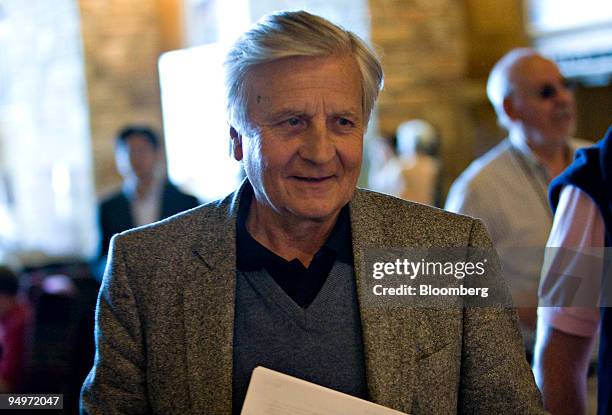 Jean-Claude Trichet, president of the European Central Bank, leaves a session during the Jackson Hole Economic Symposium at the Jackson Lake Lodge in...