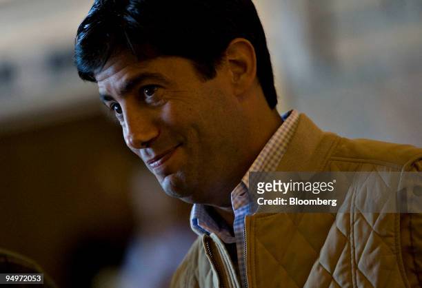 Kevin Warsh, governor of the U.S. Federal Reserve, talks with an attendee following a session during the Jackson Hole Economic Symposium at the...