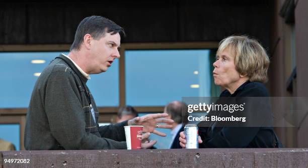 Charles Evans, president of the U.S. Federal Reserve Bank of Chicago, left, talks with Elizabeth Duke, governor of the U.S. Federal Reserve Board,...