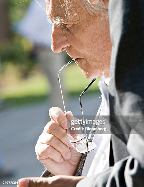 Jean-Claude Trichet, president of the European Central Bank, speaks to a reporter during a coffee break at the Jackson Hole Economic Symposium at the...