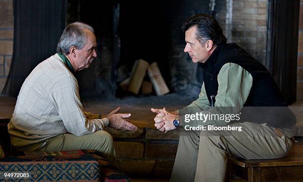 Jean-Pierre Roth, chairman of the Swiss National Bank, left, chats with Philipp Hildebrand, vice chairman, during the Jackson Hole Economic Symposium...