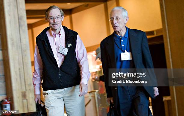 Robert Zoellick, president of the World Bank Group, left, walks with Stanley Fischer, governor of the Bank of Israel, as they arrive for a morning...