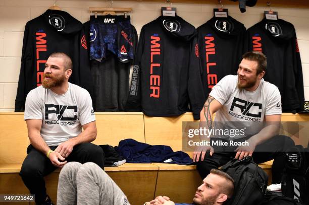Jim Miller relaxes in his locker room with brother Dan Miller prior to his bout during the UFC Fight Night event at the Boardwalk Hall on April 21,...