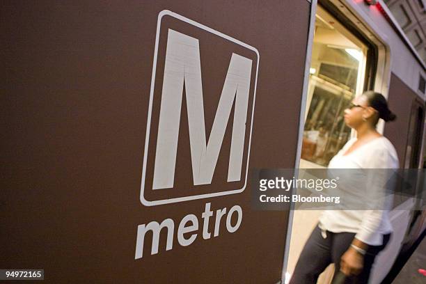 Woman enters a Red Line Metro train car at the Union Station stop in Washington, D.C., U.S., on Monday, Aug. 24, 2009. Washington's Metro, run by the...