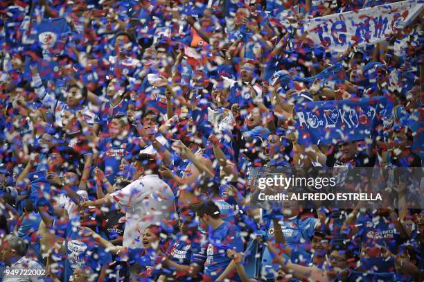 Cruz Azul's fans cheer their team during their Mexican Clausura 2018 tournament football match against Morelia at Azul stadium in Mexico City on...