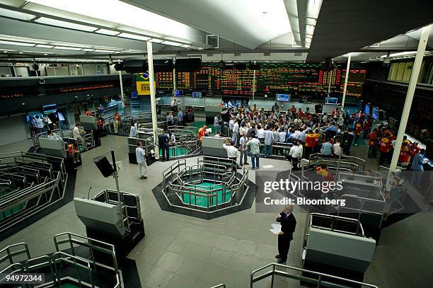 Traders work on the floor at the Brazilian Bolsa de Mercadorias e Futuros, or Brazilian Mercantile and Futures Exchange , in Sao Paulo, Brazil, on...