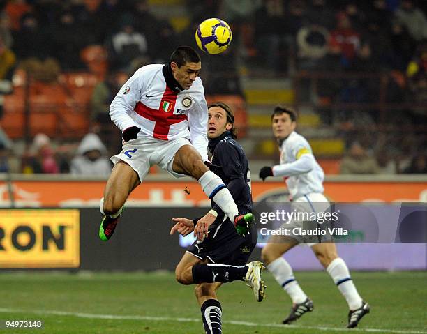 Ivan Cordoba of FC Internazionale Milano goes up for a header, watched by Stefano Mauri of Lazio during the Serie A match between Inter Milan and SS...