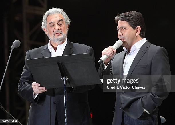 Singers Placido Domingo and Placido Domingo Jr perform at Angel de la Independencia on December 19, 2009 in Mexico City, Mexico.