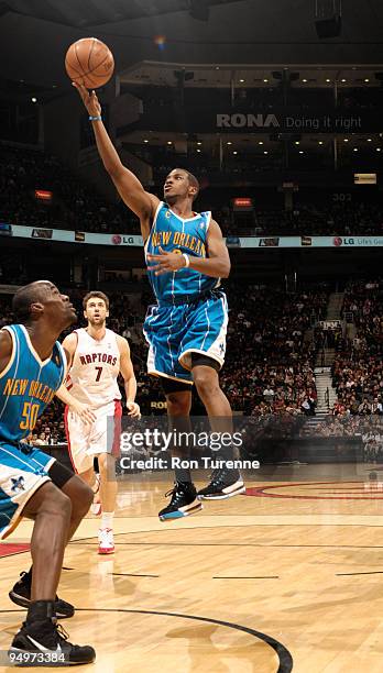 Chris Paul of the New Orleans Hornets glides to the basket and hopes to sink the floater during a game against the Toronto Raptors on December 20,...