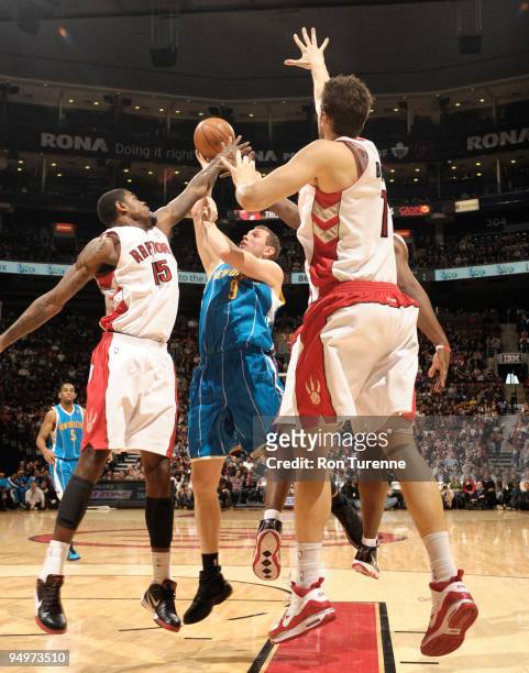 Darius Songaila of the New Orleans Hornets draws the triple-team during a contest against the Toronto Raptors on December 20, 2009 at the Air Canada...