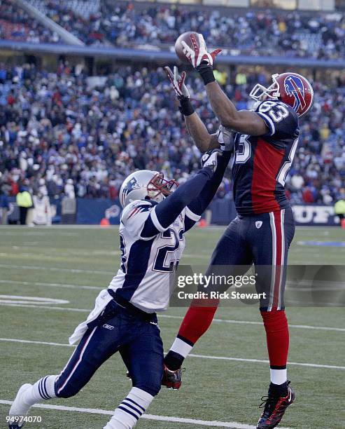 Lee Evans of the Buffalo Bills makes a catch as Leigh Bodden of the New England Patriots defends at Ralph Wilson Stadium on December 20, 2009 in...