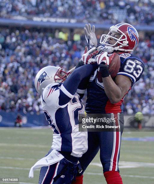 Lee Evans of the Buffalo Bills makes a catch as Leigh Bodden of the New England Patriots defends at Ralph Wilson Stadium on December 20, 2009 in...