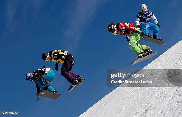 Lindsey Jacobellis races Maelle Ricker of Canada as other riders try to catch up during the FIS Snowboardcross Team World Cup 2010 on December 20,...