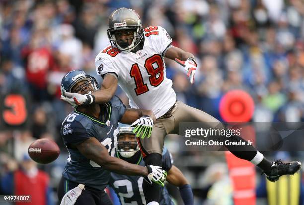 Wide receiver Sammie Stroughter of the Tampa Bay Buccaneers just misses a catch against Lawyer Milloy of the Seattle Seahawks on December 20, 2009 at...