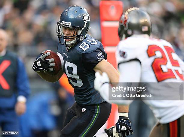 Tight end John Carlson of the Seattle Seahawks scores a touchdown against Aqib Talib of the Tampa Bay Buccaneers on December 20, 2009 at Qwest Field...