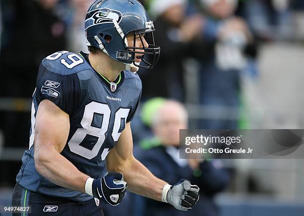 Tight end John Carlson of the Seattle Seahawks celebrates after scoring a touchdown against the Tampa Bay Buccaneers on December 20, 2009 at Qwest...