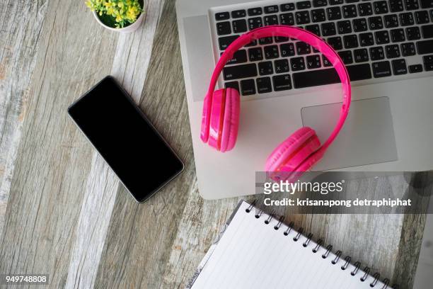 headphones and laptop. online music listening. music concept. - dog dj stock pictures, royalty-free photos & images