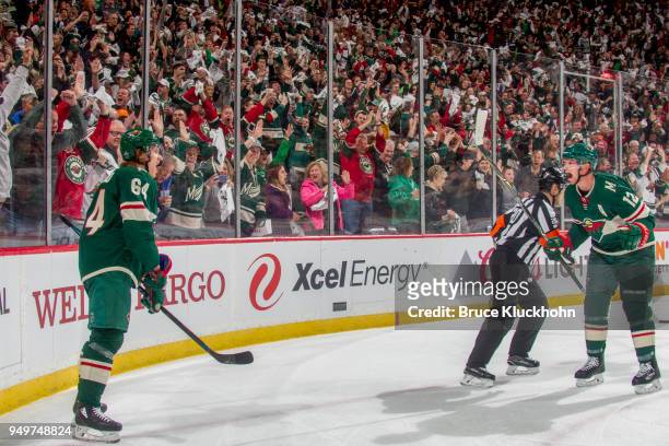 Mikael Granlund celebrates his goal with teammate Eric Staal of the Minnesota Wild against the Winnipeg Jets in Game Three of the Western Conference...