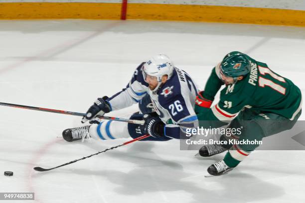 Zach Parise of the Minnesota Wild is called for a tripping penalty against Blake Wheeler of the Winnipeg Jets in Game Three of the Western Conference...