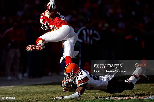Receiver Mark Bradley of the Kansas City Chiefs is upended by Brandon McDonald of the Cleveland Browns after making a catch during the game on...