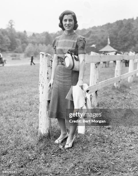 Janet Norton Lee Bouvier, mother of Jacqueline Kennedy Onassis standing by a fence in Tuxedo Park, New York, June 4, 1938