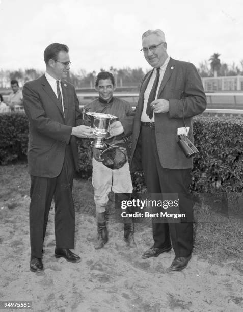 Francis I du Pont, jockey Herbert Hinojosa, and Walter H Coleman at Hialeah Race Track, Florida, c1962