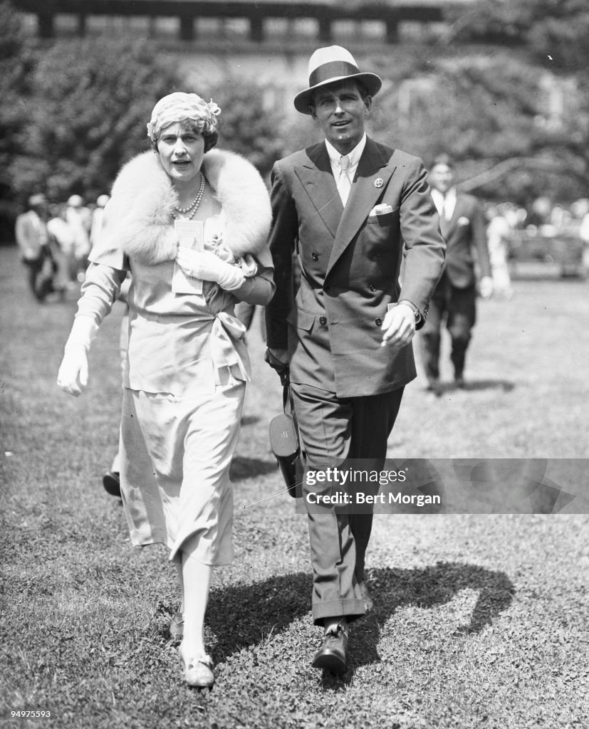 Mrs Edward F Hutton (General Foods heiress Marjorie Merriweather Post) and her son-in-law Thomas Wells "Tim" Durant walk together at Belmont Park race track, NY, May 29, 1933