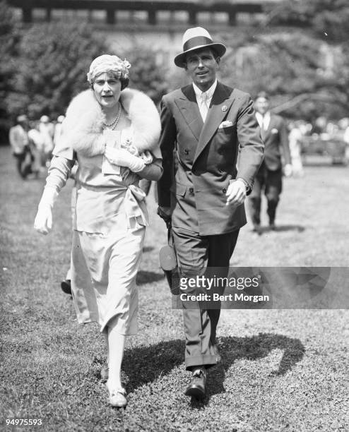 Mrs Edward F Hutton and her son-in-law Thomas Wells "Tim" Durant walk together at Belmont Park race track, NY, May 29, 1933