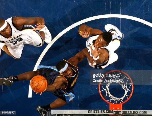 Ty Lawson of the Denver Nuggets shoots a layup over Hasheem Thabeet of the Memphis Grizzlies on December 20, 2009 at FedExForum in Memphis,...