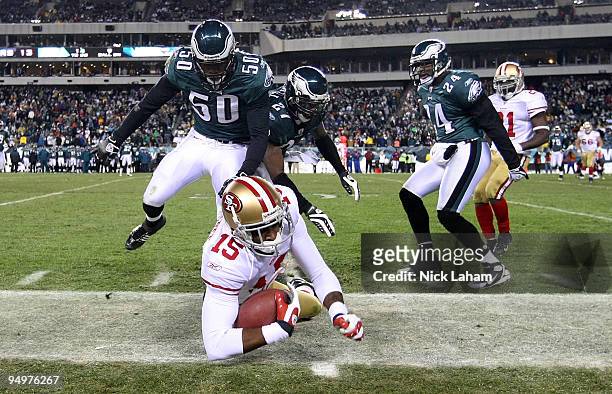 Michael Crabtree of the San Francisco 49ers is tackled over the sideline by the Philadelpia Eagles defense at Lincoln Financial Field on December 20,...