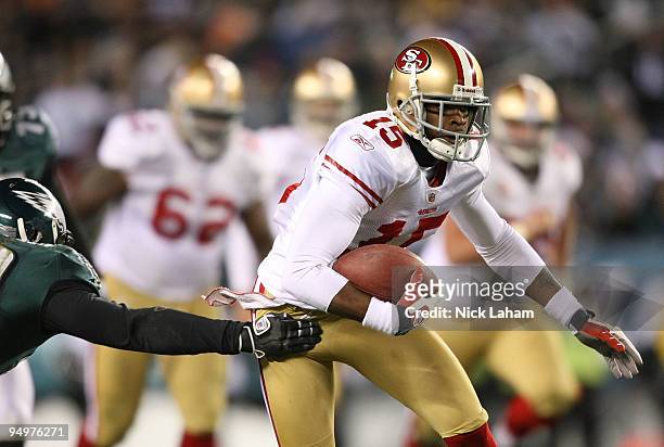Michael Crabtree of the San Francisco 49ers rushes against the Philadelpia Eagles defense at Lincoln Financial Field on December 20, 2009 in...