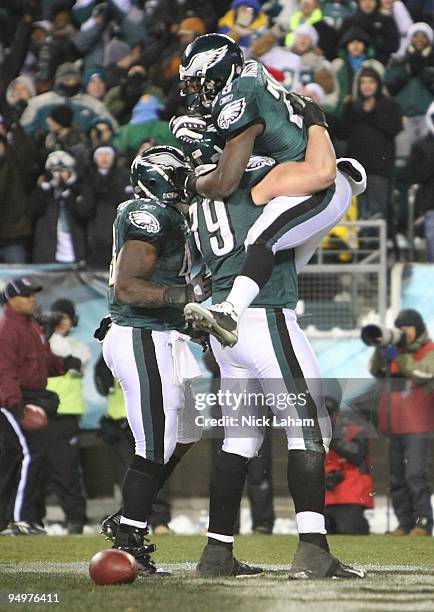 LeSean McCoy of the Philadelphia Eagles jumps onto teammate Todd Herremans after his touchdown against the San Francisco 49ers at Lincoln Financial...