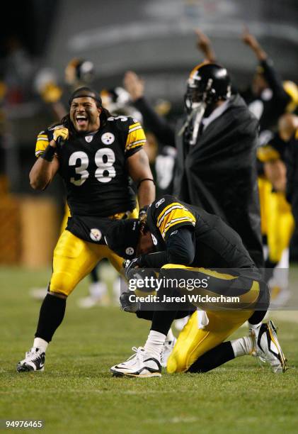 Carey Davis and Ben Roethlisberger of the Pittsburgh Steelers celebrate after the game winning touchdown against the Green Bay Packers was confirmed...