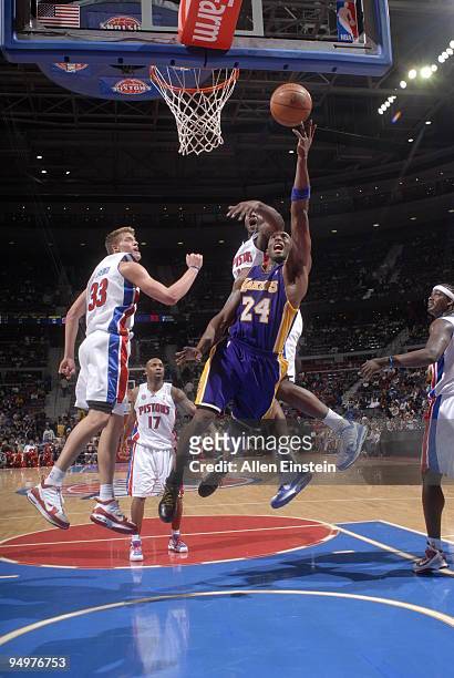 Kobe Bryant of the Los Angeles Lakers attempts a shot past DaJuan Summers of the Detroit Pistons in a game at the Palace of Auburn Hills on December...