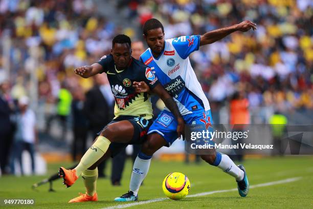 Brayan Angulo of Puebla struggles for the ball against Alex Ibarra Mina of America during the 16th round match between Puebla and America as part of...