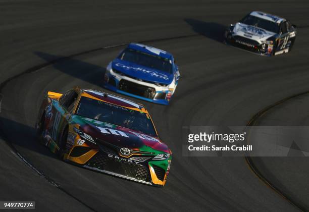 Kyle Busch, driver of the M&M's Flavor Vote Toyota, leads a pack of cars during the Monster Energy NASCAR Cup Series Toyota Owners 400 at Richmond...