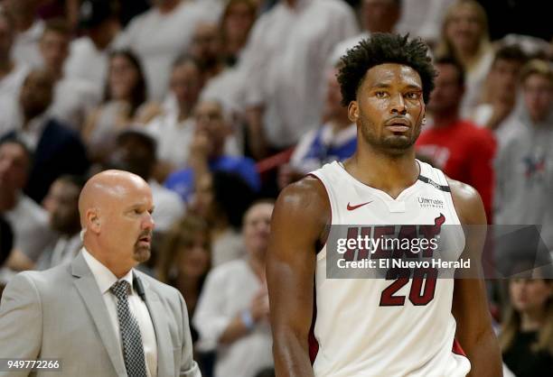 The Miami Heat's Justise Winslow walks back to the bench bleeding over his left eye after being hit in the second quarter against the Philadelphia...