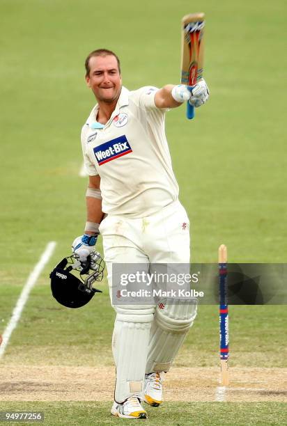 Phil Jaques of the Blues celebrates reaching his century during day four of the Sheffield Shield match between the New South Wales Blues and the...
