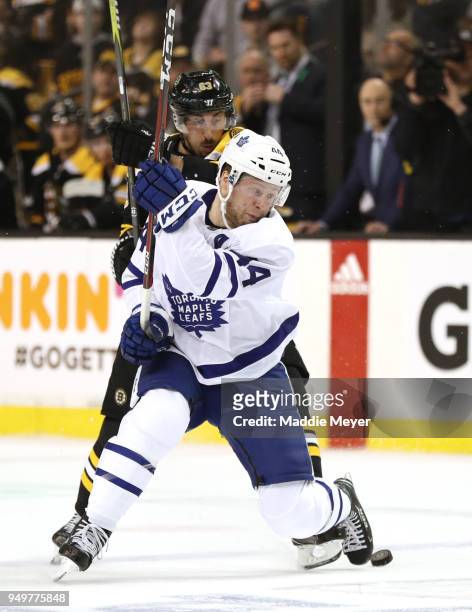 Brad Marchand of the Boston Bruins defends Morgan Rielly of the Toronto Maple Leafs during the first period of Game Five of the Eastern Conference...