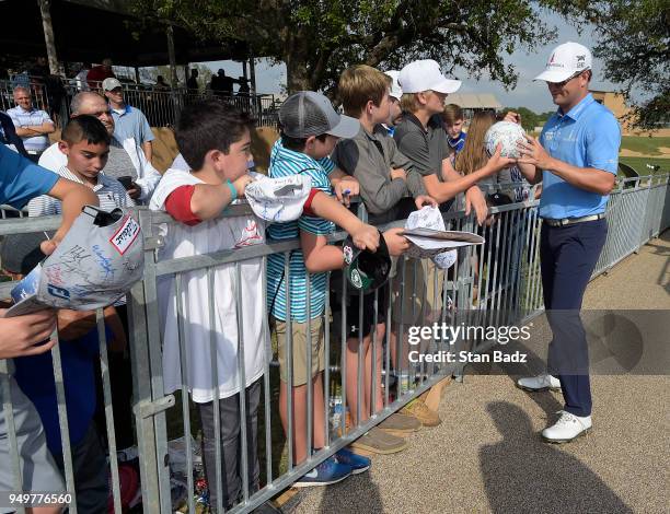 Zach Johnson signs autographs for young fans in the kids zone during the third round of the Valero Texas Open at TPC San Antonio - AT&T Oaks course...