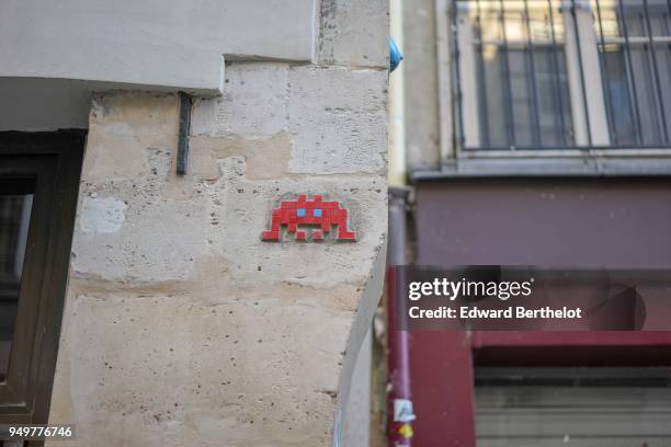 Street art by artist Invader, on April 21, 2018 in Paris, France.